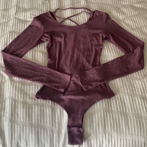 Purple, criss-cross open back body suit
